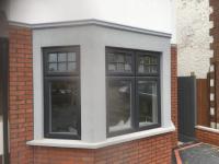 Outside completed with polymer render and brick slips.